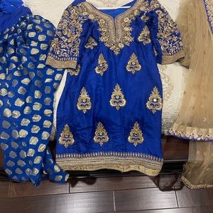 Navy blue salwar suit with gold accents.
